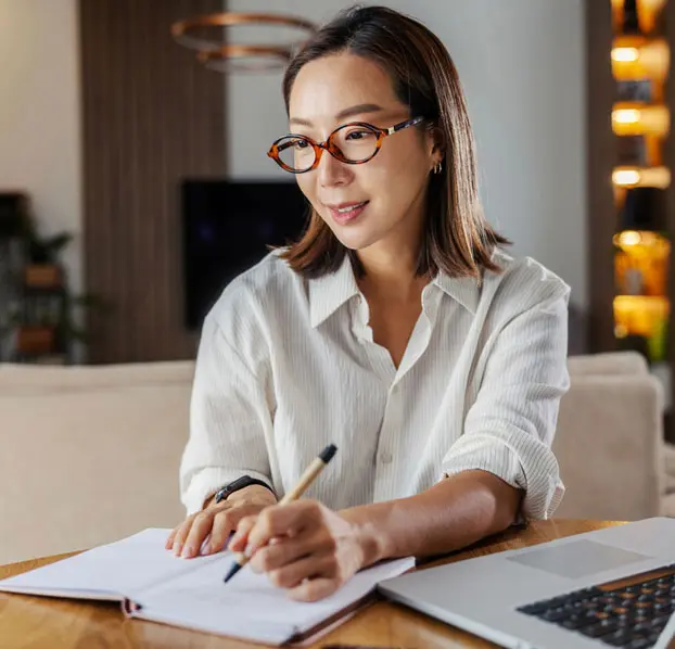 Woman working from home on her career goals.